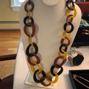 Gorgeous long resin necklace and rich warm colors